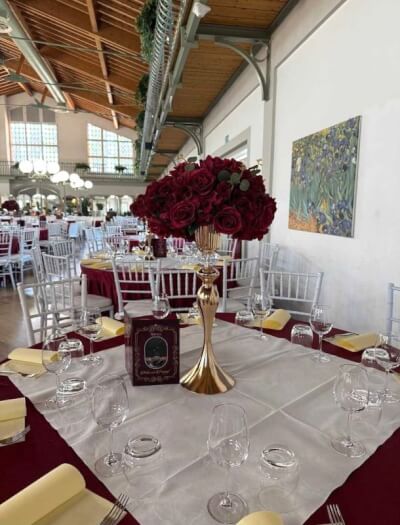 Luxurious Burgundy Reception Décor with Gold Vase, Linens & Rose Centerpiece