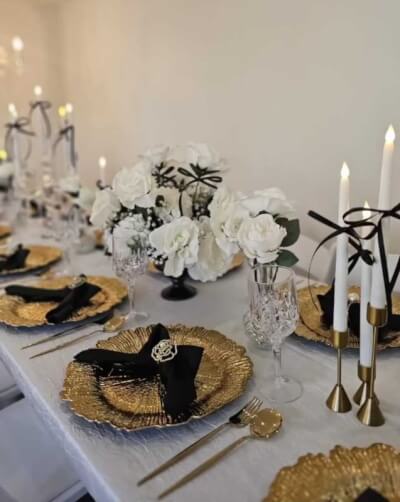 Modern Luxe Table Setting in Black, White, and Gold for Chic Celebrations