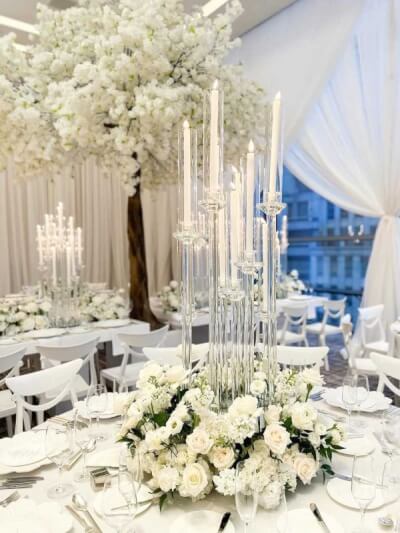 Ethereal White Wedding Décor with Glass Candleholders, Rose Centerpieces & Draped Elegance