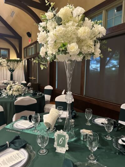 Timeless Emerald Green and White Décor with Tall Floral Centerpieces and Satin Linens