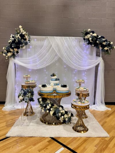 Golden Glamour Meets Blooming Elegance in This White-Draped Dessert Table Arrangement
