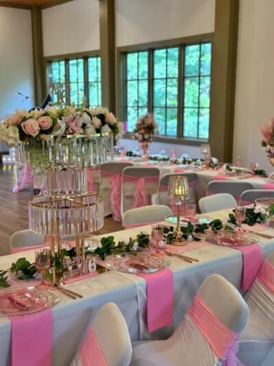 Pretty in Pink Table Décor with Crystal Stands, Floral Accents & Romantic Chair Sashes