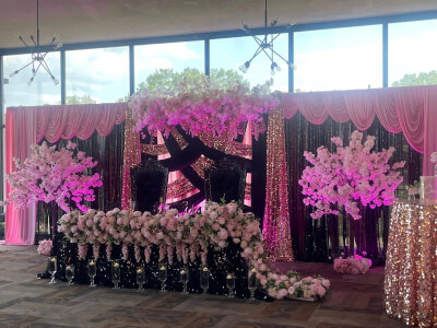 Celebrating in Glam Style with Sparkling Pink and Black Drapes, Cherry Blossoms & Throne Chairs